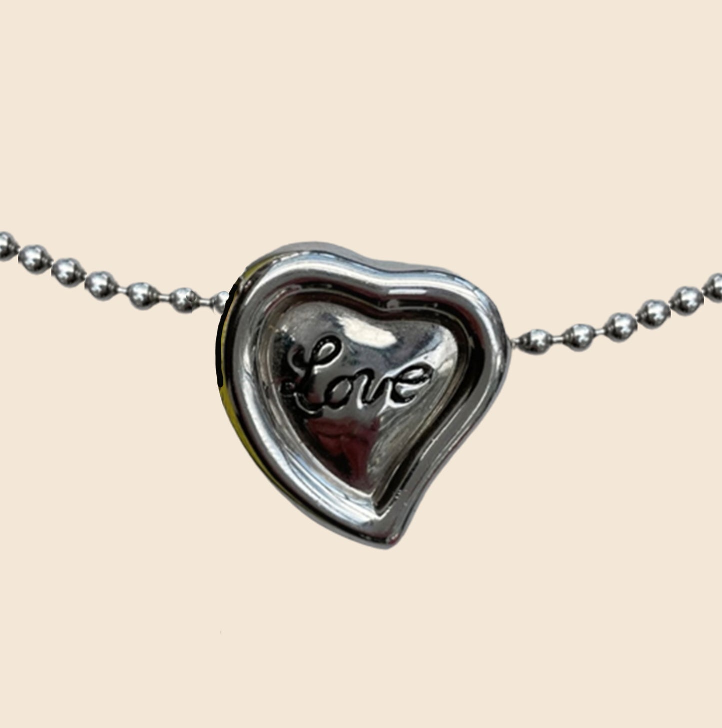 YVES SAINT LAURENT SILVER "LOVE" NECKLACE