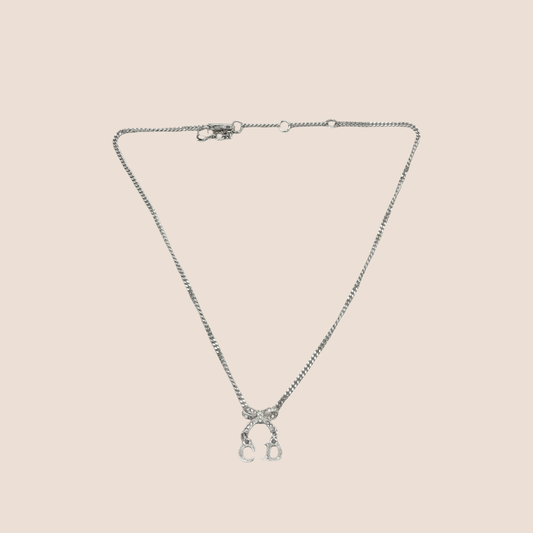 CHRISTIAN DIOR SILVER CRYSTAL INITIAL BOW PENDANT NECKLACE